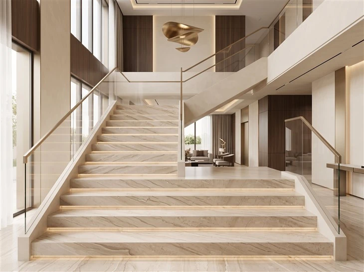 Daino Beige Marble wall tiles with visible joints forming a full-height feature wall in a luxury hotel lobby